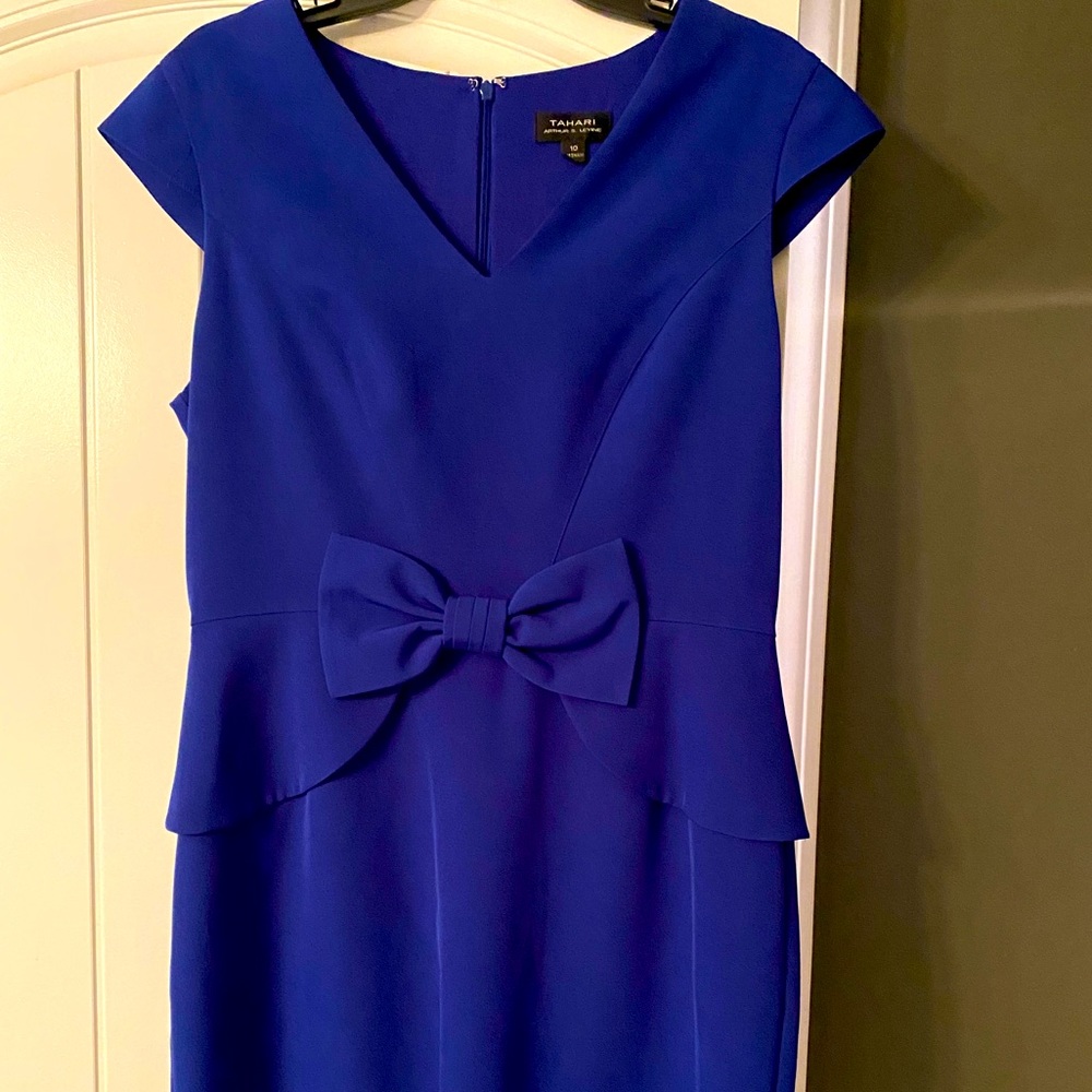 Royal blue shapely dress with slight peplum.